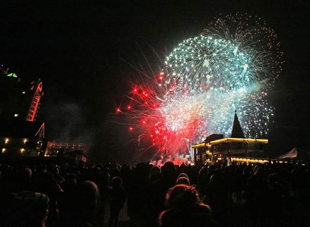 Spectators watch fireworks erupt in the sky above Lake Coeur d'Alene REsort Holiday light show fireworks display