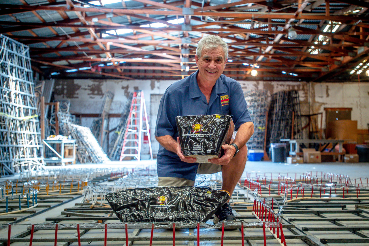 Pyro Spectaculars CEO Jim Souza shows different types of aerial firework shells inside a firework assembly building in Rialto on Thursday, June 17, 2021. (Photo by Watchara Phomicinda, The Press-Enterprise/SCNG)